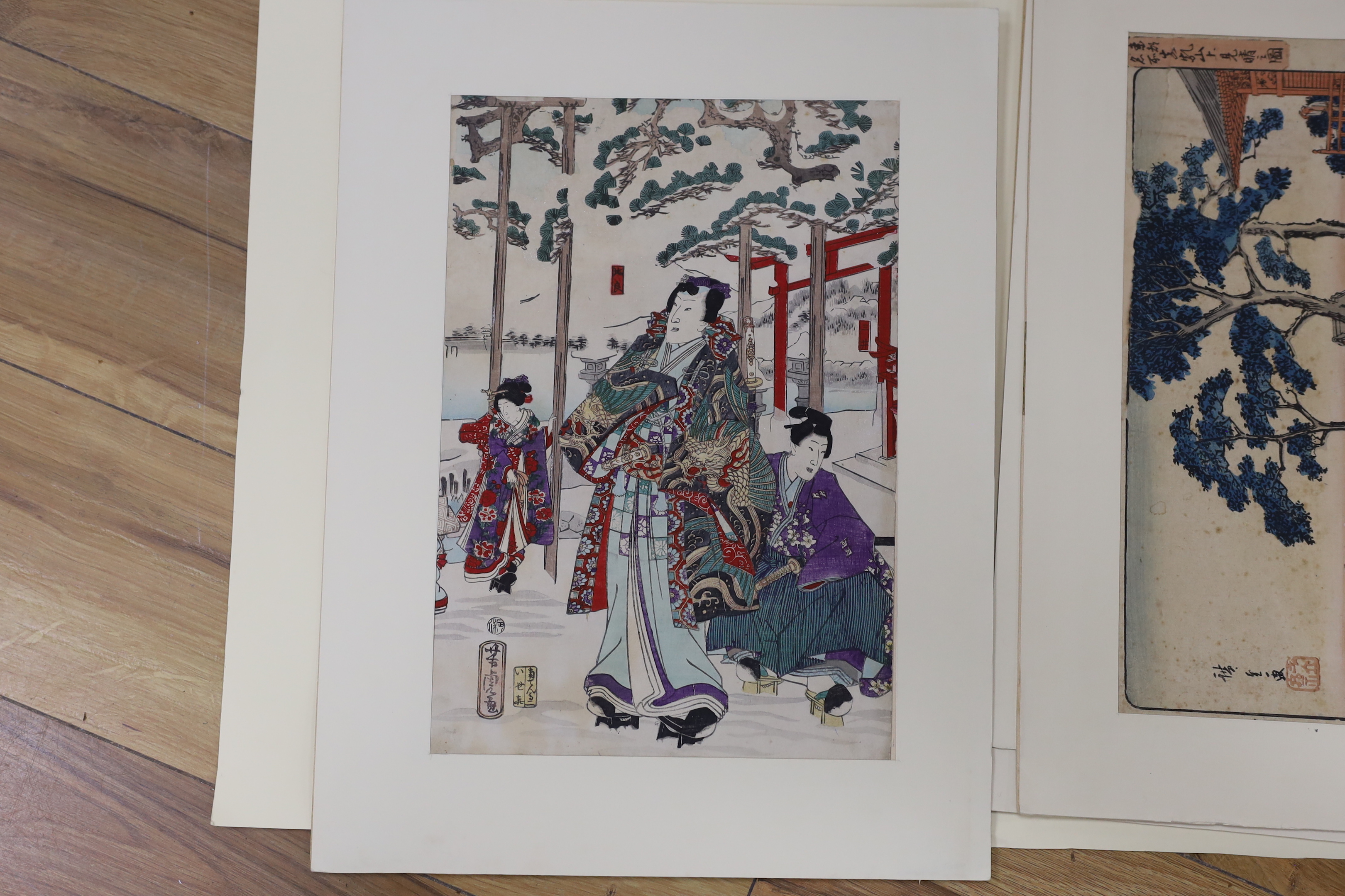 A folio of six Japanese woodblock prints, including examples after Utagawa Kunisada and Utagawa Kunisada II, mounted, unframed, 34 x 23cm